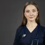 medium-shot-smiley-nurse-with-stethoscope-scaled.
